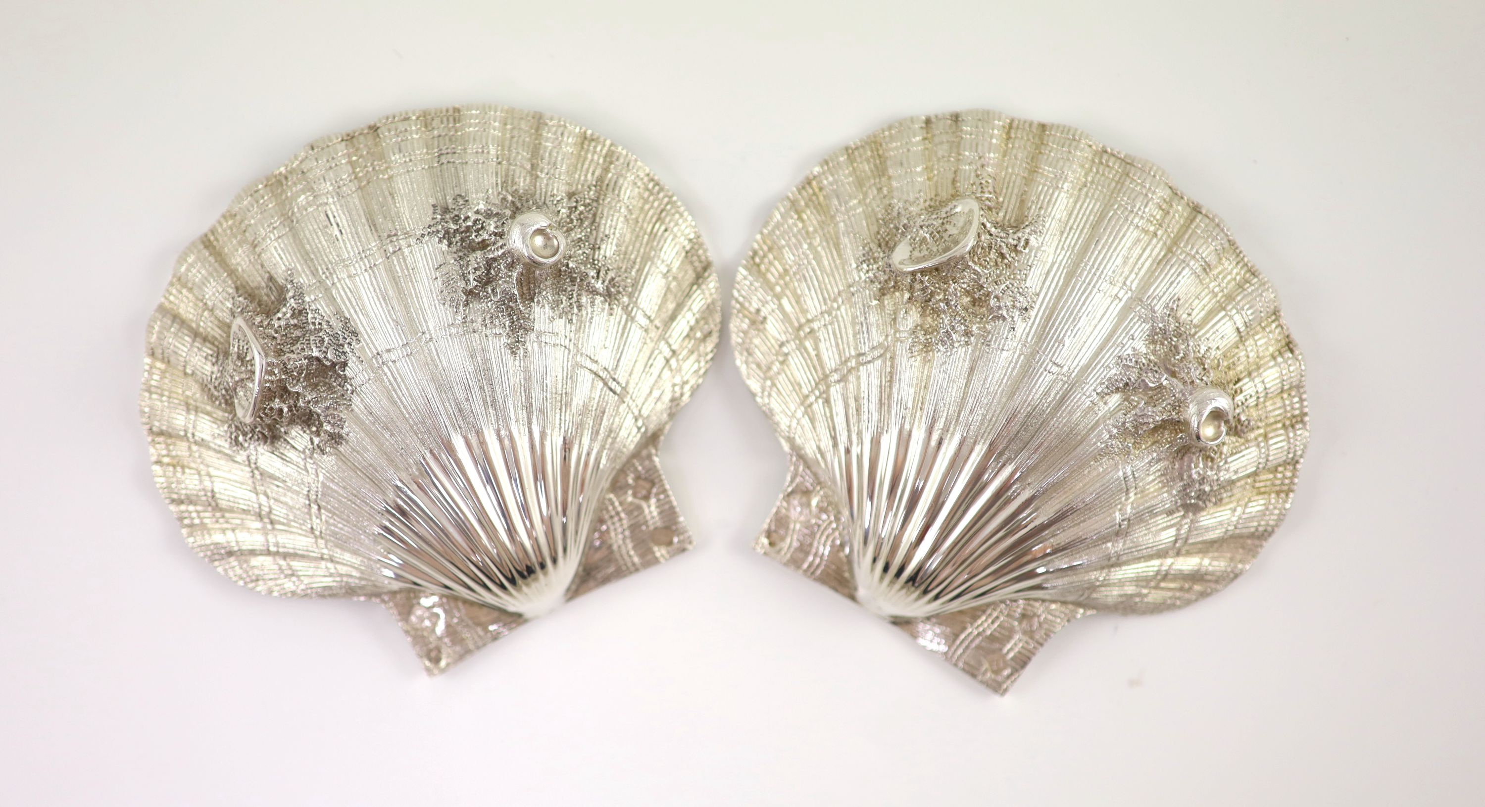 A pair of cast silver scallop shell butter dishes, C & J Vander, London 1975,